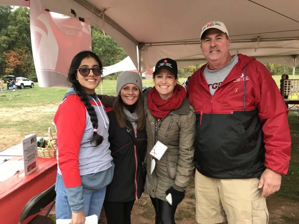 Connecting with other participants at the event tent
