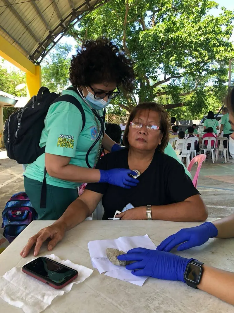 Community members waiting to receive care and supplies